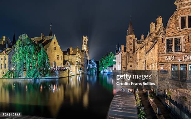 bruges illuminated at night with the belfort - canal disney stock pictures, royalty-free photos & images