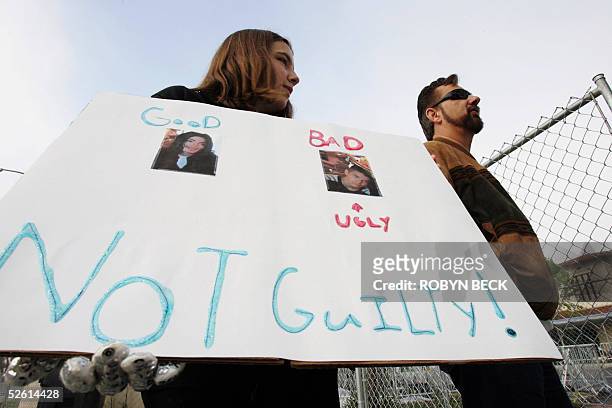Chloe Medeiros waits with her father Steve Medeiros to catch a glimpse of US pop star Michael Jackson as he arrives at Santa Barbara County Superior...