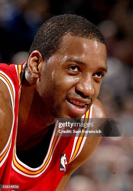 Tracy McGrady of the Houston Rockets looks on against the Portland Trail Blazers during a game on March 30, 2005 at the Rose Garden Arena in...