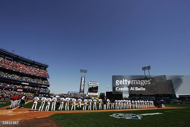 The New York Mets stand for the National Anthem before their home opening game against the Houston Astros April 11, 2005 at Shea Stadium in Flushing,...