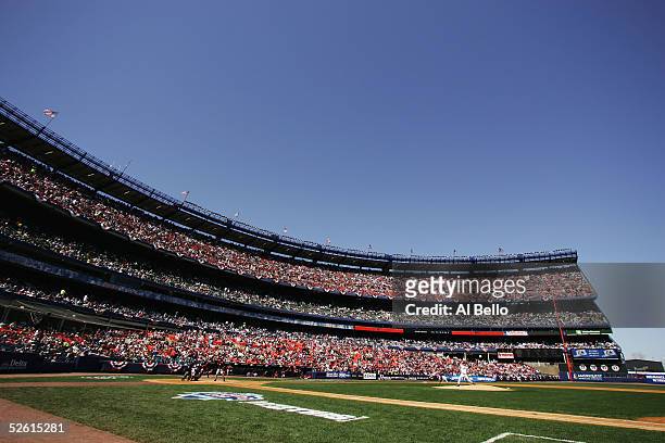 Tom Glavine of the New York Mets throws the first pitch of the game against the Houston Astros during their home opening game April 11, 2005 at Shea...