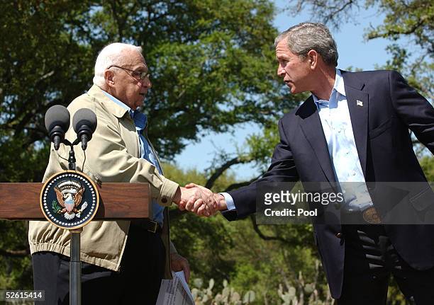 President George W. Bush shakes hands with Israel's Prime Minister Ariel Sharon April 11, 2005 following a joint news conference in Crawford, Texas....