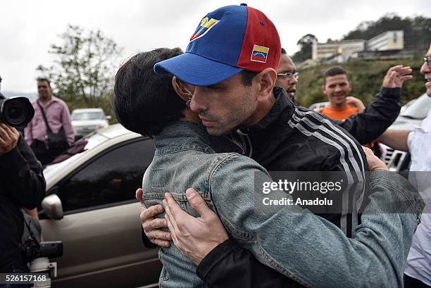 Antonioneta Mendoza mother of jailed opposition leader Leopoldo Lopez hugs Governor of Miranda state Henrique Capriles outside of the military prison...