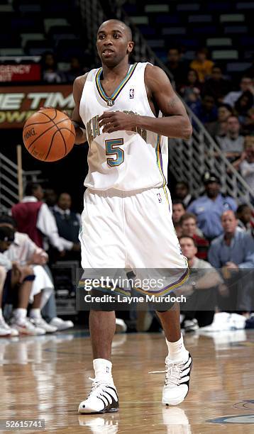 Speedy Claxton of the New Orleans Hornets dribbles the ball down the court against the New Jersey Nets on March 9, 2005 at the New Orleans Arena in...