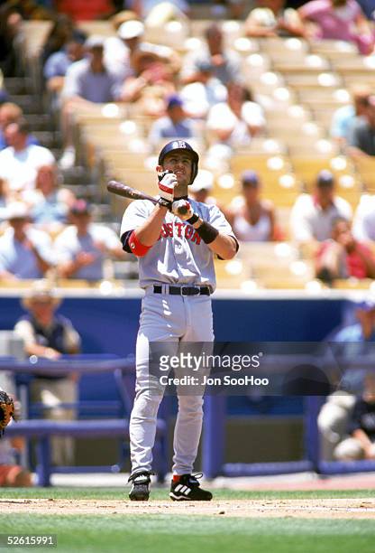 Nomar Garciaparra of the Boston Red Sox fixes his batting gloves during a 2002 season game at Dodger Stadium in Los Angeles, California. Nomar...