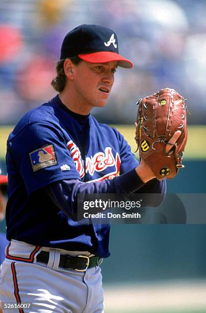 Tom Glavine of the Atlanta Braves gets the signs during a 1994 season game. Tom Glavine played for the Atlanta Braves from 1987-2002.