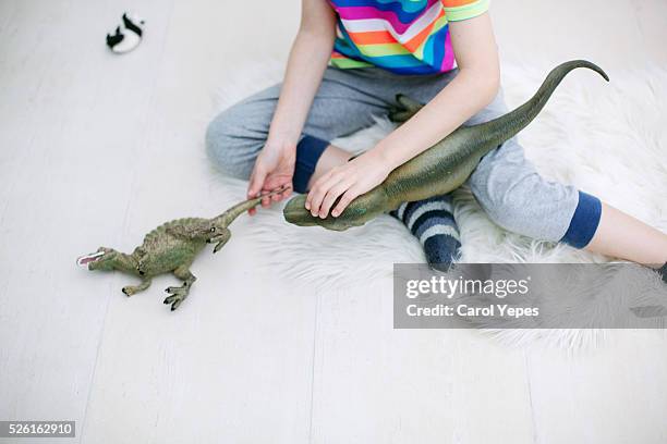 overhead shot of boy playing dinosaur toys - dinosaur toy i stock pictures, royalty-free photos & images