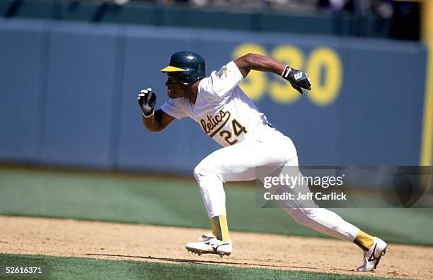 Rickey Henderson of the Oakland Athletics runs during a season game at Network Associates Coliseum in Oakland, Califoornia. Rickey Henderson played...