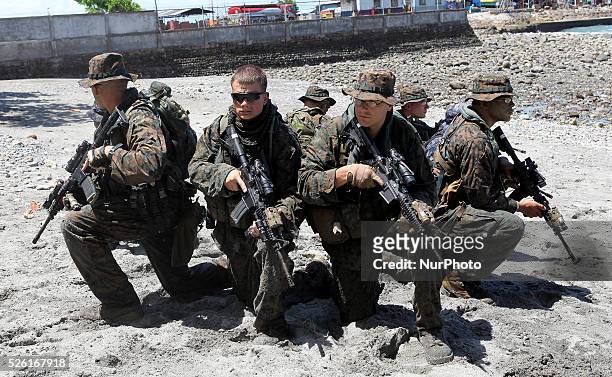 In this picture taken July 2012 shows US soldiers participate in a military exercise training in the southern Philippine city of General Santos....