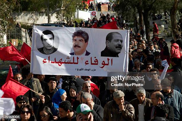 Banner of the Popular Front Martyrs Left Fadhel Sassi center Mohamed Brahmi and left Chokri Belaid. On the occasion of the commemoration of the first...