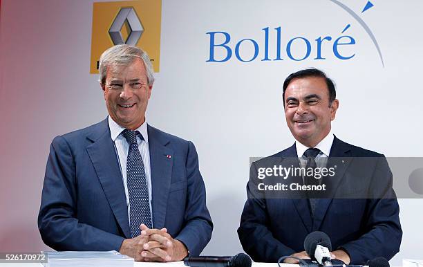 The CEO of French carmaker Renault, Carlos Ghosn, and French industrial group Bollore head Vincent Bollore give a press conference at the Atelier...