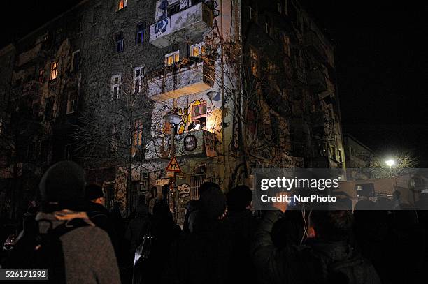 Resident of Liebigstra��e 34 speaks during the press conference on Riga street in Berlin, Germany from a balcony. The inhabitants of the occupied...