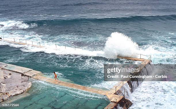 Icebergs Swimming Club amid the rocks and ocean of Bondi beach in winter, Australia --- Image by �� Paul Cunningham/Corbis