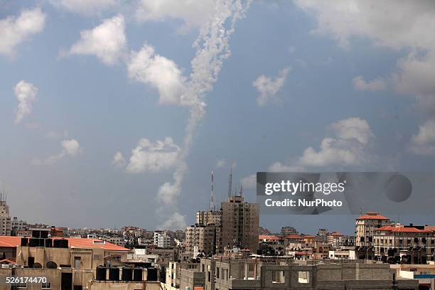 Smoke trails are seen after missiles were fired by Palestinian militants from Gaza City towards southern Israel, Israel approved an Egyptian-proposed...