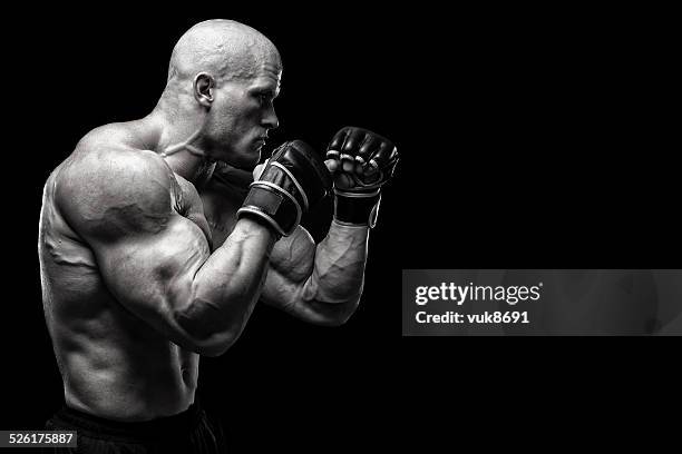 powerful fighter - punsch stock pictures, royalty-free photos & images