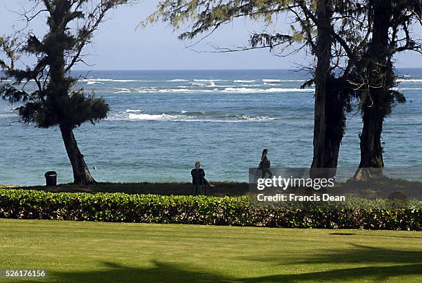 Visitors at View of Pono kai resort at Kapa'a beach park at Kauai Island on Hawaii 1 jan 2013