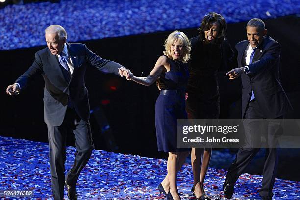 President Barack Obama stands with first lady Michelle Obama and Vice President Joe Biden and his wife Jill as they face supporters following his...