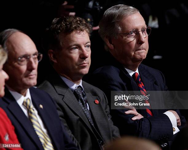 Senator Rand Paul and U.S. Senate Minority Leader Mitch McConnell listen to U.S. Vice President Joe Biden and Republican vice presidential nominee...
