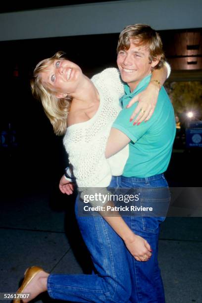 American actor Christopher Atkins pose with fiancee Lynne Barron at Charles Kinsford Smith airport in 1985 in Sydney, Australia.
