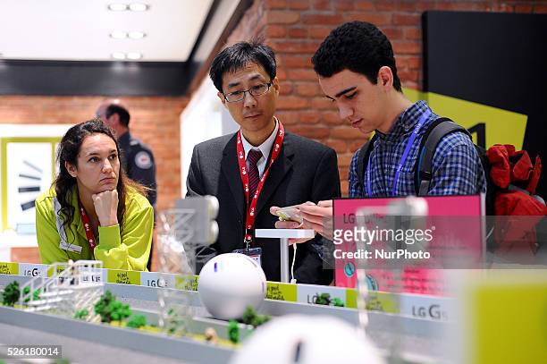 Congressmen testing the new LG Rolling Bot, during the last day of Mobile World Congress in Barcelona, 24th of February, 2016.