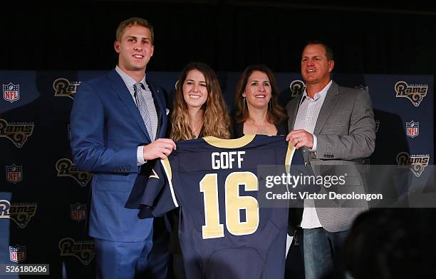Jared Goff , the Los Angeles Rams first pick and first overall pick of the 2016 NFL Draft, and his family hold up his jersey after the press...
