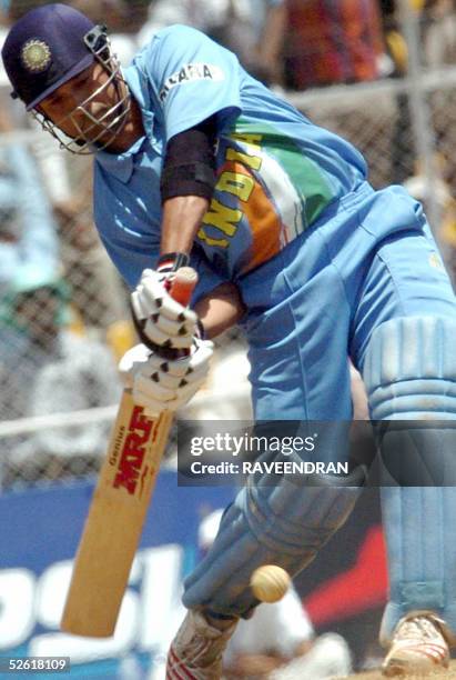 Indian cricketer Sachin Tendulkar swings a shot on his way to a century during the fourth one day international between India and Pakistan at the...