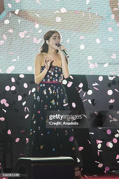 Martina Stoessel sings a track of Tini during the premiere of Tini-La nuova vita di Violetta at Auditorium Parco della Musica on April 2016 in Rome,...