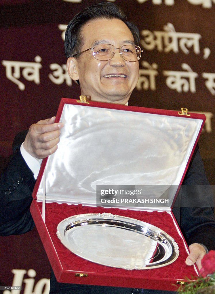Chinese Prime Minister Wen Jiabao poses