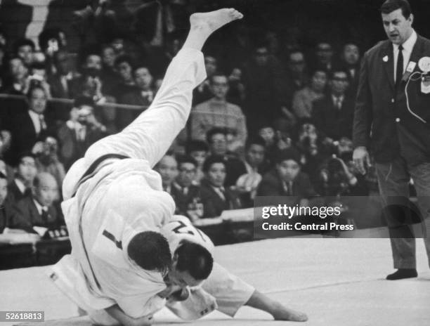 Japanese wrestler Isao Inokuma beats Canada's Alfred Douglas Rogers in the Judo Heavyweight final at the Tokyo Olympics, 1964.
