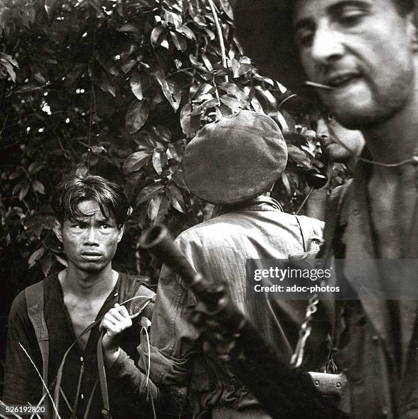 French Indochina War. A red-suspect has been found hiding in the jungle and is now being questioned by the advance patrol of the French Foreign...