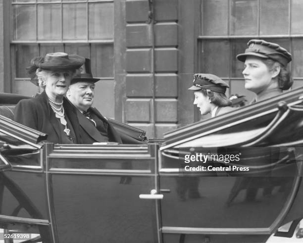 British Prime Minister Winston Churchill in an open carriage on his way to the City of London, where he is to be presented with the Freedom of the...