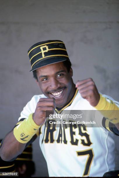 Rookie outfielder Barry Bonds of the Pittsburgh Pirates jokes with people in the dugout at McKechnie Field during spring training in March 1986 in...