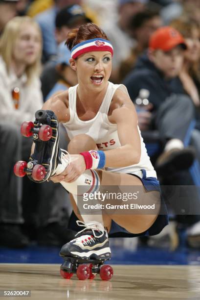 Denver Nuggets cheerleader performs during the game against the Washington Wizards on March 22, 2005 at the Pepsi Center in Denver, Colorado. The...