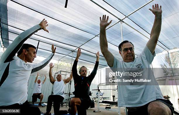 Trainer Larry Indiviglia leads a stretching class with seniors at the Island Gym in Coronado, CA. Many gyms across the country are seeing a rise in...