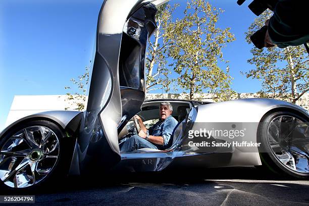 Nightly talk show host and comedian Jay Leno during a test drive of a Jaguar C-X75 hybrid, electric car outside of his car garage in Burbank,...
