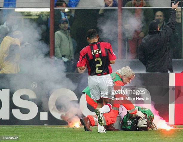 Milan goalkeeper Dida is struck by a flare during the UEFA Champions League quarter-final second leg between AC Milan and Inter Milan at the San Siro...