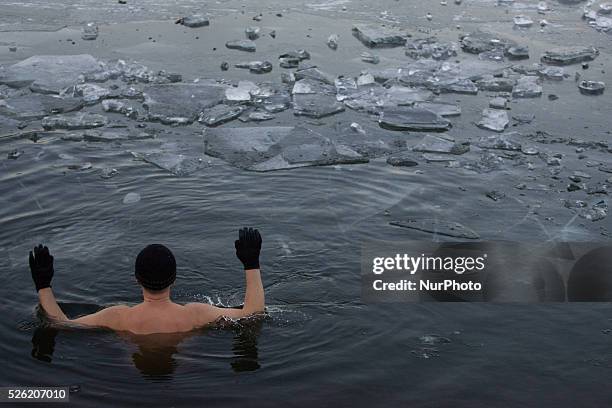 Bydgoszcz, Poland, 02 Jauary 2016 - People go swimming outdoors after nights of frost. After temperatures hit record highs in December the new year...