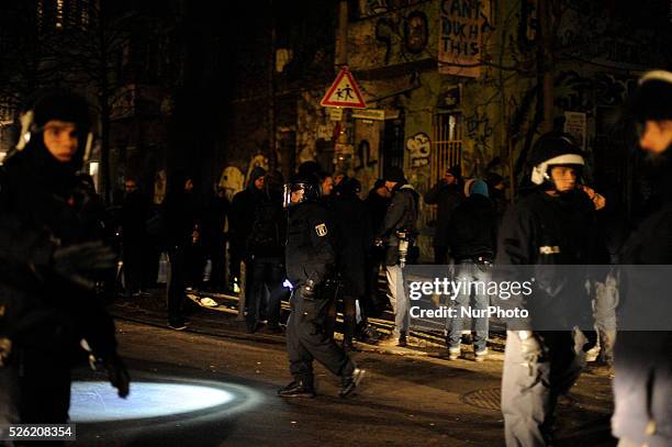 Policemen evacuate after the press conference on Riga street in Berlin, Germany the village square. The inhabitants of the occupied house...