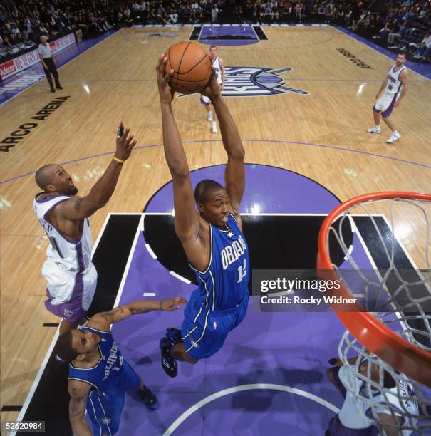 Dwight Howard of the Orlando Magic makes a rebound against the Sacramento Kings at Arco Arena on March 15, 2005 in Sacramento, California. The Kings...