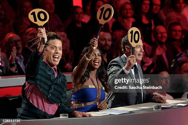 Jurors Jorge Gonzalez, Motsi Mabuse and Joachim Llambi show the 10-points-sign during the 7th show of the television competition 'Let's Dance' at...