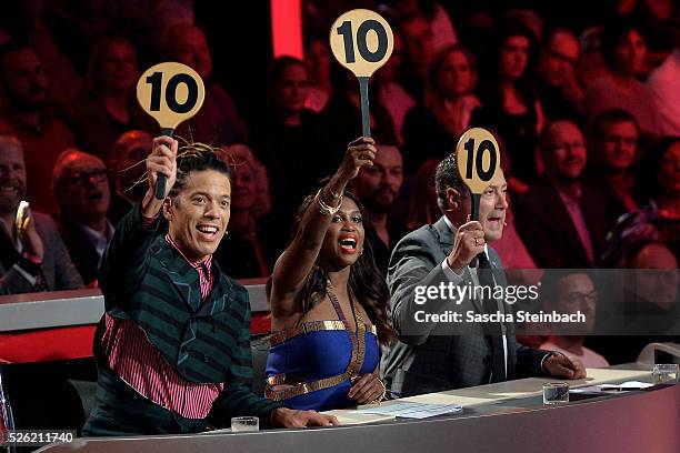 Jurors Jorge Gonzalez, Motsi Mabuse and Joachim Llambi show the 10-points-sign during the 7th show of the television competition 'Let's Dance' at...