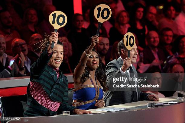 Jurors Jorge Gonzalez, Motsi Mabuse and Joachim Llambi show the 10-points-sign during the 7th show of the television competition 'Let's Dance' at...