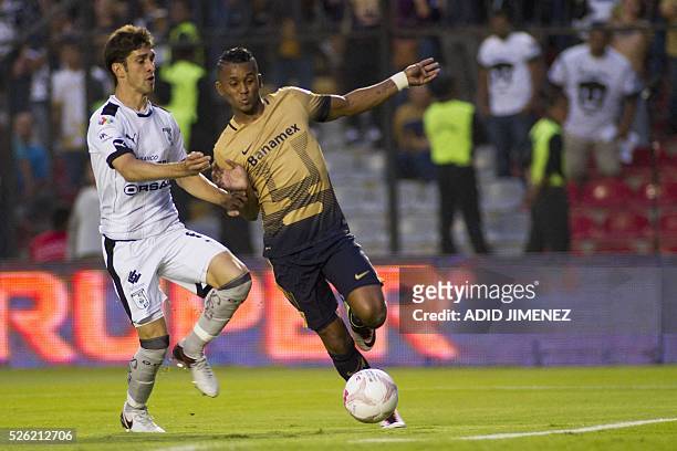 Queretaro's defender Juan Forlin vies for the ball with Pumas's midfielder Fidel Martinez during their Mexican Clausura tournament football match at...