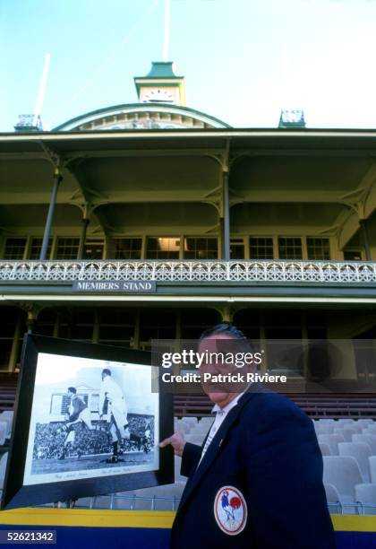 Former French rugby League player Puig-Aubert of his real name Aubert Puig, poses in front of a large print showing him playing against Australia in...
