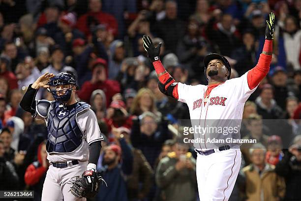 David Ortiz of the Boston Red Sox celebrates after hitting a two-run home run in the eighth inning during the game against the New York Yankees at...