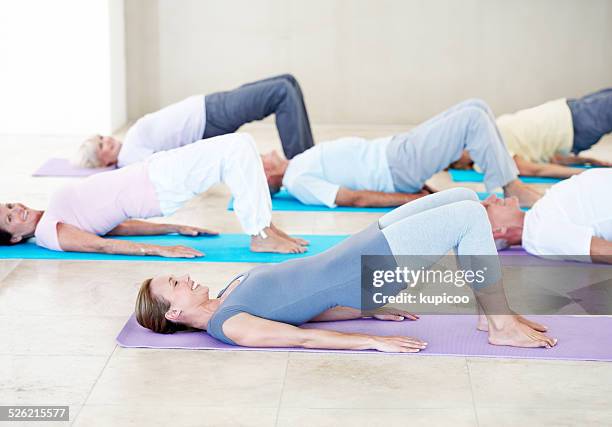 yoga for health and happiness - old trying to look young stock pictures, royalty-free photos & images