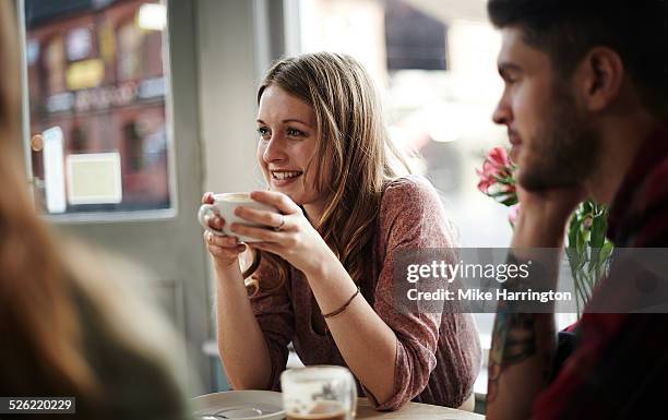 young female in cafe - friends drinking stock pictures, royalty-free photos & images