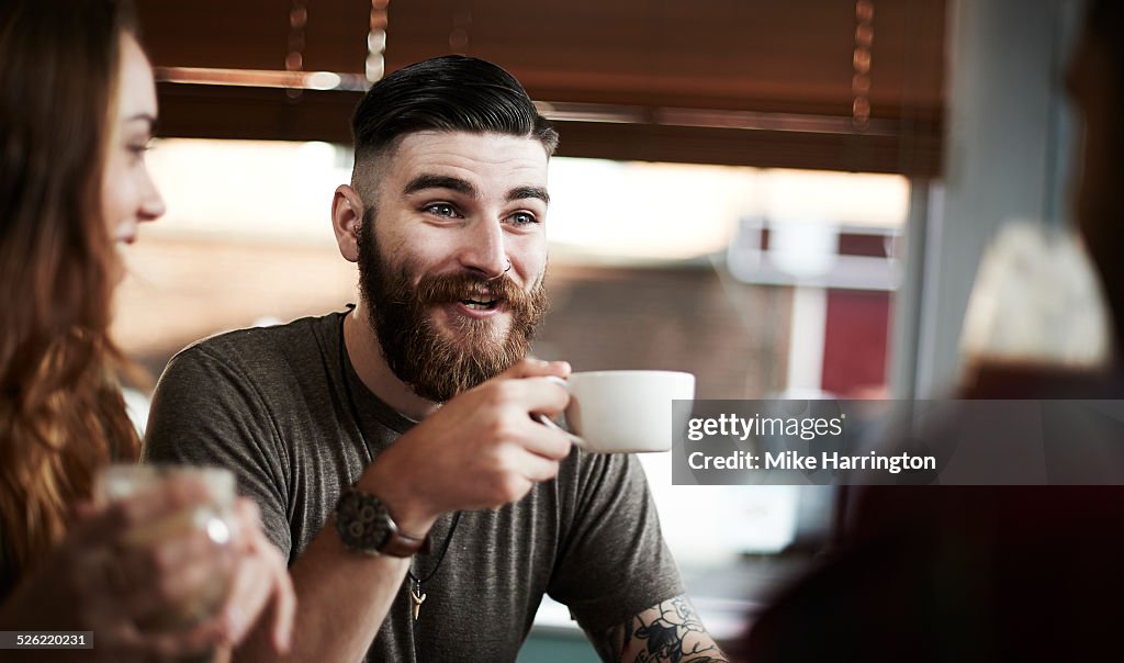 Young male in urban cafe