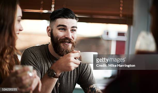 young male in urban cafe - selective focus imagens e fotografias de stock