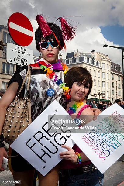 Participants of a gay pride parade in Brussels proposing free hugs.